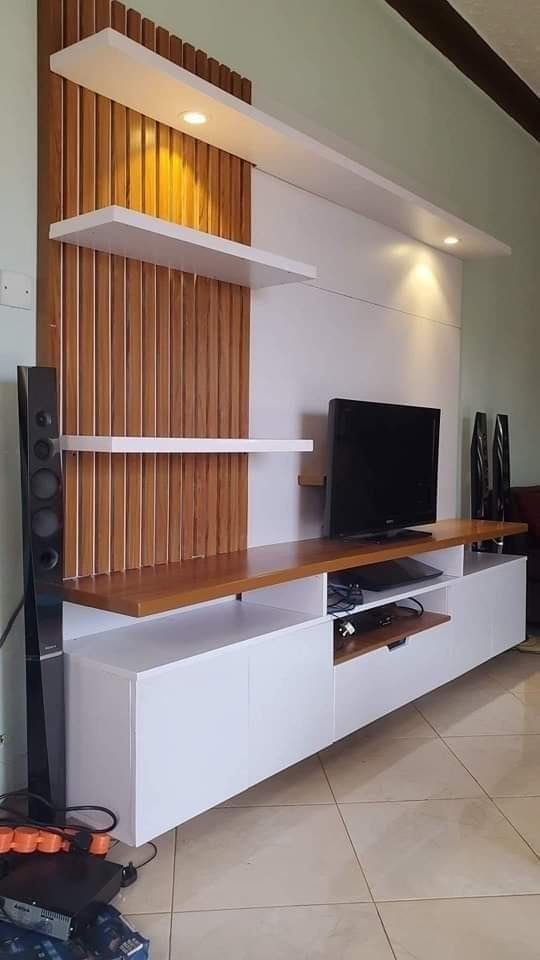 Modern TV cabinet with wooden batten panel in Vizag
