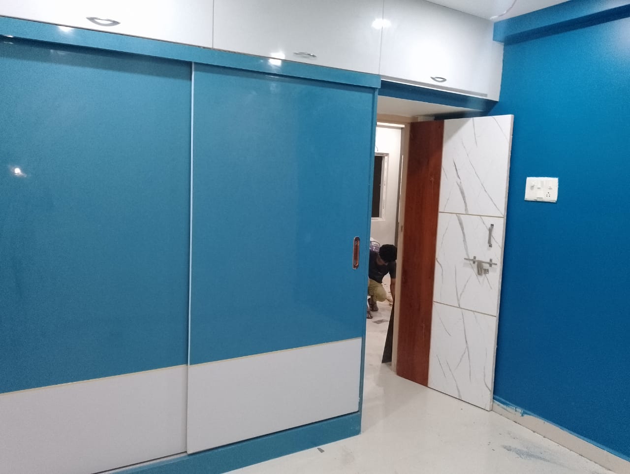 Aqua blue sliding wardrobe with loft storage in Vizag